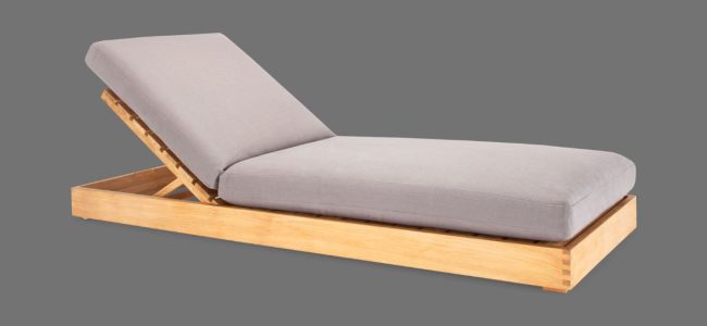 A daybed with a grey cushion